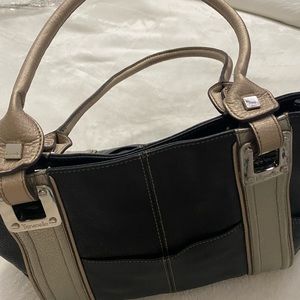 Tiganello black handbag with metallic accents